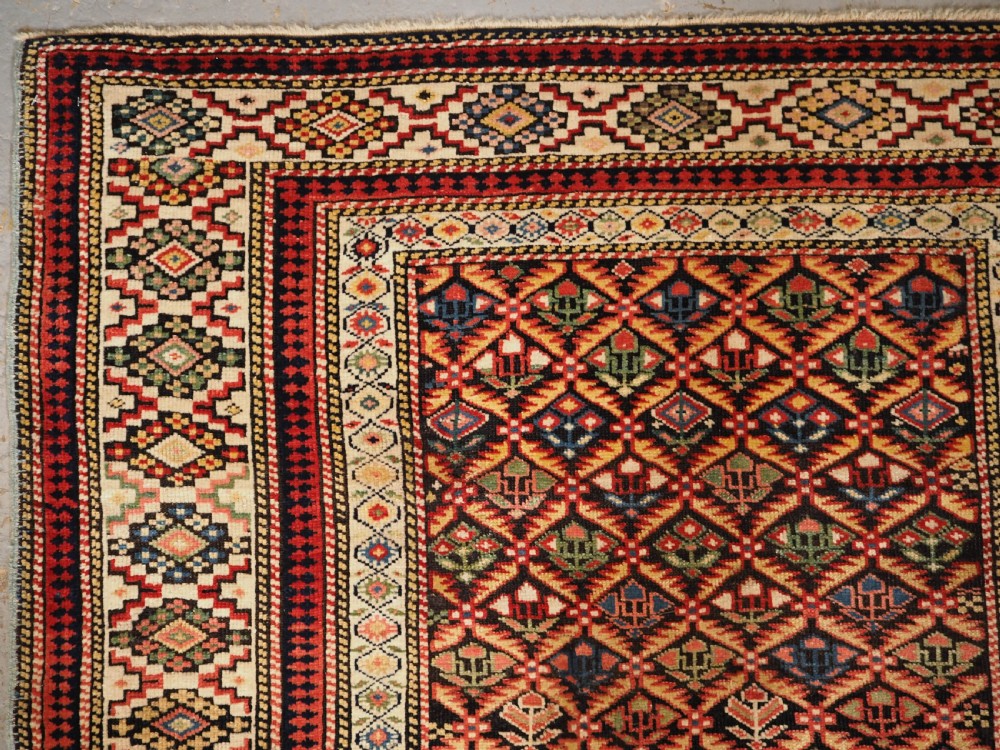 ANTIQUE CAUCASIAN KUBA SHIRVAN RUG OF FLORAL LATTICE DESIGN, CIRCA 1880. View VI