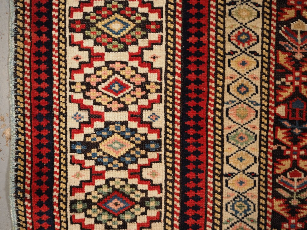 ANTIQUE CAUCASIAN KUBA SHIRVAN RUG OF FLORAL LATTICE DESIGN, CIRCA 1880. View VII