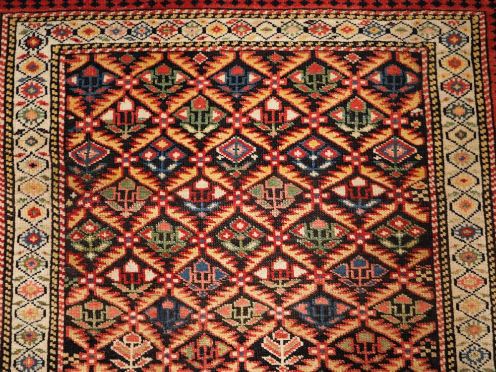 ANTIQUE CAUCASIAN KUBA SHIRVAN RUG OF FLORAL LATTICE DESIGN, CIRCA 1880. View VIII