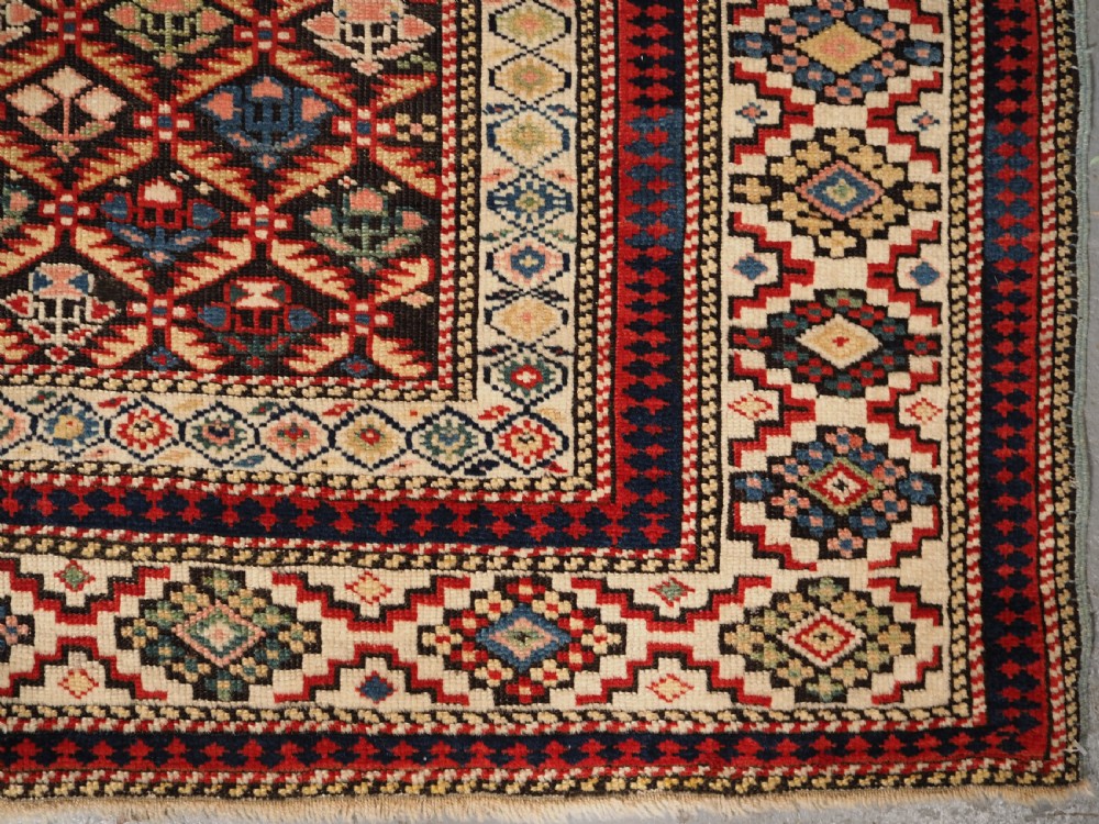 ANTIQUE CAUCASIAN KUBA SHIRVAN RUG OF FLORAL LATTICE DESIGN, CIRCA 1880. View X