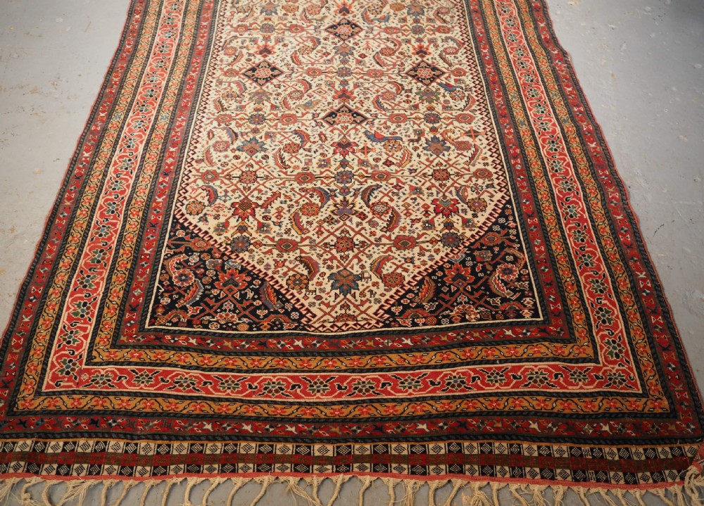 ANTIQUE QASHQAI LONG RUG, IVORY GROUND HERATI DESIGN WITH TIBAL ELEMENTS,  CIRCA 1870. View V