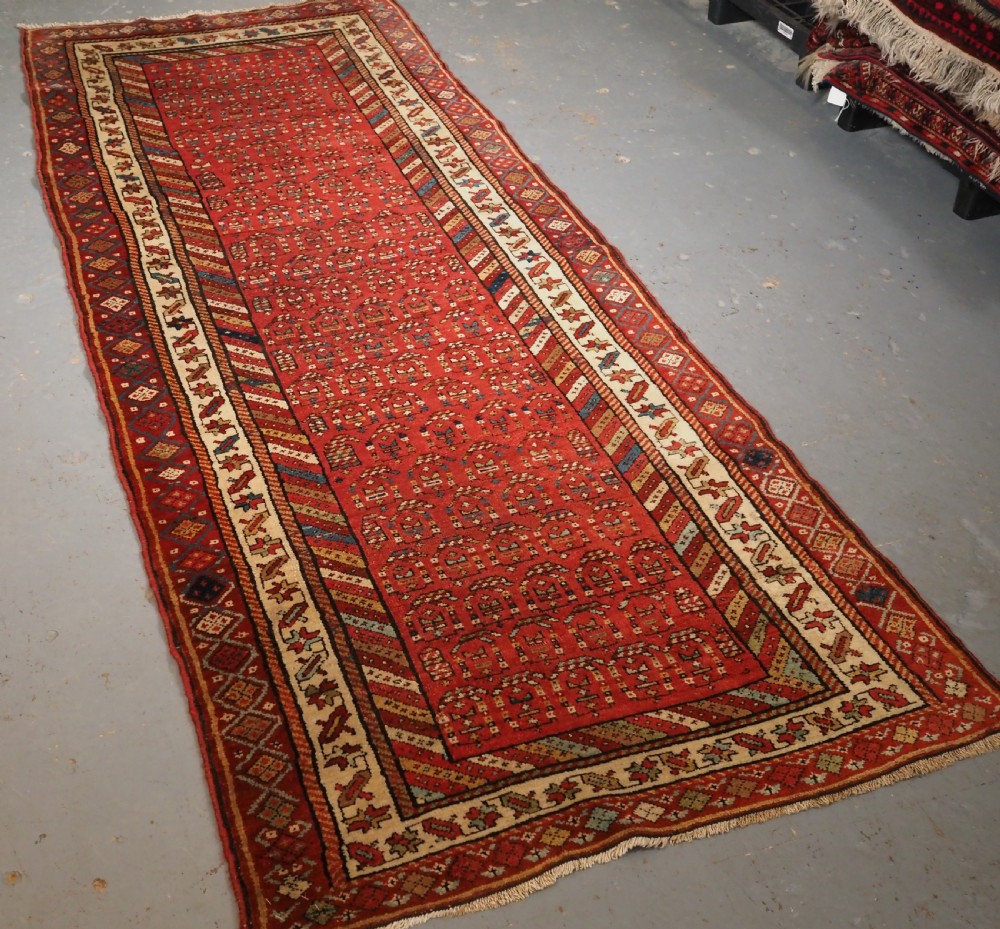ANTIQUE KURDISH LONG RUG WITH ALL OVER BOTEH DESIGN, CIRCA 1900. View II