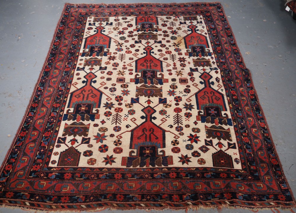 ANTIQUE AFSHAR NERIZ RUG WITH SHIELD DESIGN, CIRCA 1900.