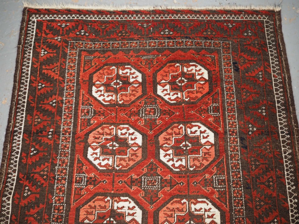 ANTIQUE MAHDAD KHANI BALUCH RUG, LARGE TURKMEN GULS, CIRCA 1900. View III