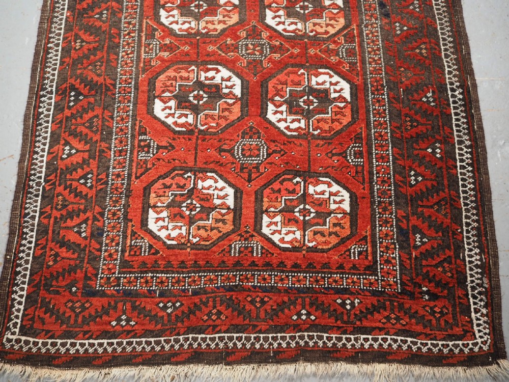 ANTIQUE MAHDAD KHANI BALUCH RUG, LARGE TURKMEN GULS, CIRCA 1900. View VI