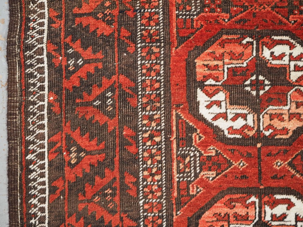 ANTIQUE MAHDAD KHANI BALUCH RUG, LARGE TURKMEN GULS, CIRCA 1900. View VII