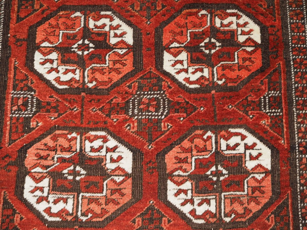 ANTIQUE MAHDAD KHANI BALUCH RUG, LARGE TURKMEN GULS, CIRCA 1900. View IX