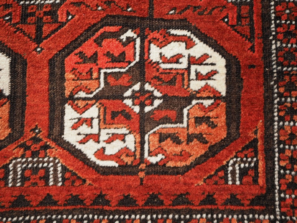 ANTIQUE MAHDAD KHANI BALUCH RUG, LARGE TURKMEN GULS, CIRCA 1900. View XI