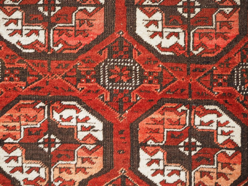 ANTIQUE MAHDAD KHANI BALUCH RUG, LARGE TURKMEN GULS, CIRCA 1900. View XII