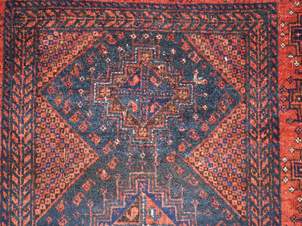 ANTIQUE FERDOWS BALUCH RUG OF SCARCE DESIGN, CIRCA 1900. View VIII
