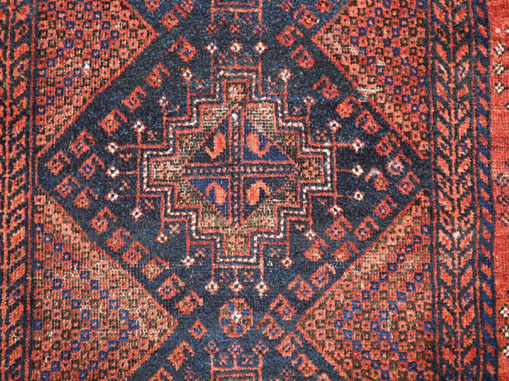ANTIQUE FERDOWS BALUCH RUG OF SCARCE DESIGN, CIRCA 1900. View IX