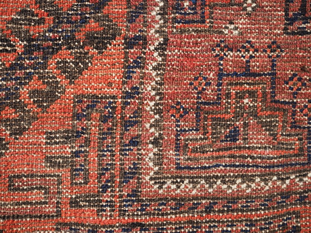 ANTIQUE FERDOWS BALUCH RUG OF SCARCE DESIGN, CIRCA 1900. View XII