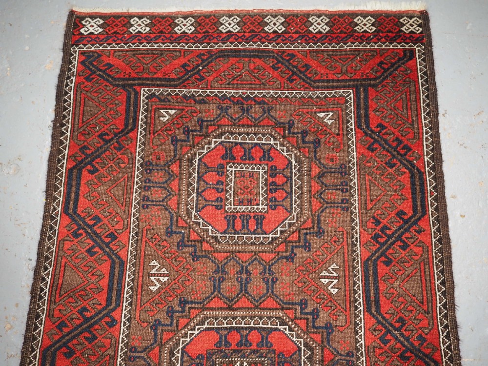 ANTIQUE SALAR KHANI BALUCH RUG, TURRETED GUL DESIGN, CIRCA 1900. View III