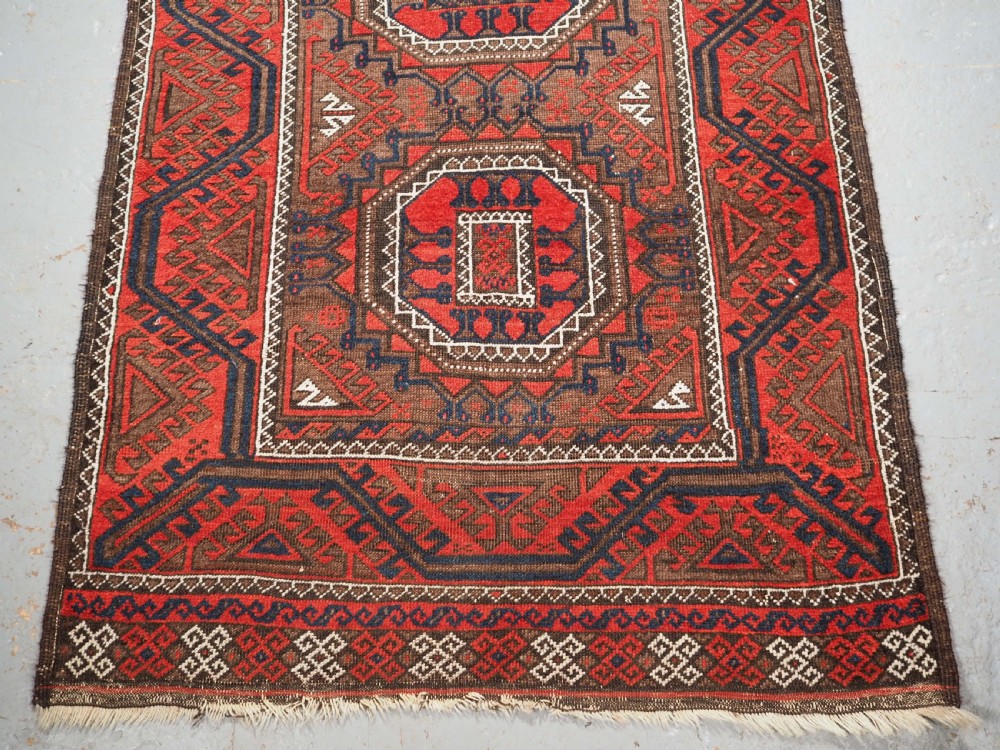 ANTIQUE SALAR KHANI BALUCH RUG, TURRETED GUL DESIGN, CIRCA 1900. View V