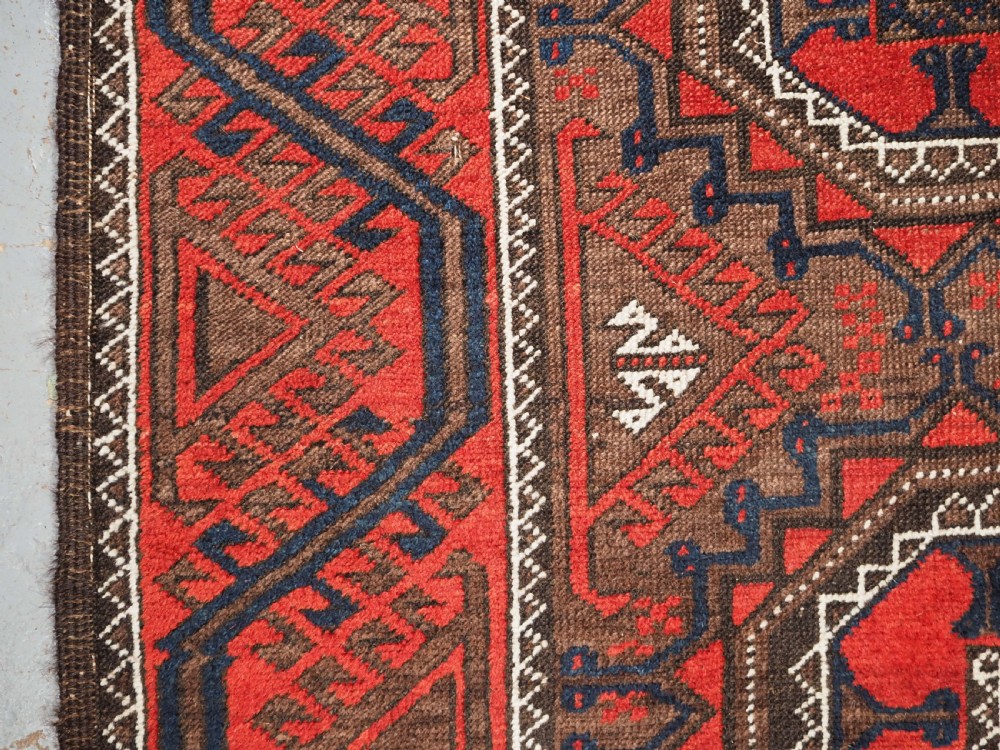 ANTIQUE SALAR KHANI BALUCH RUG, TURRETED GUL DESIGN, CIRCA 1900. View VII