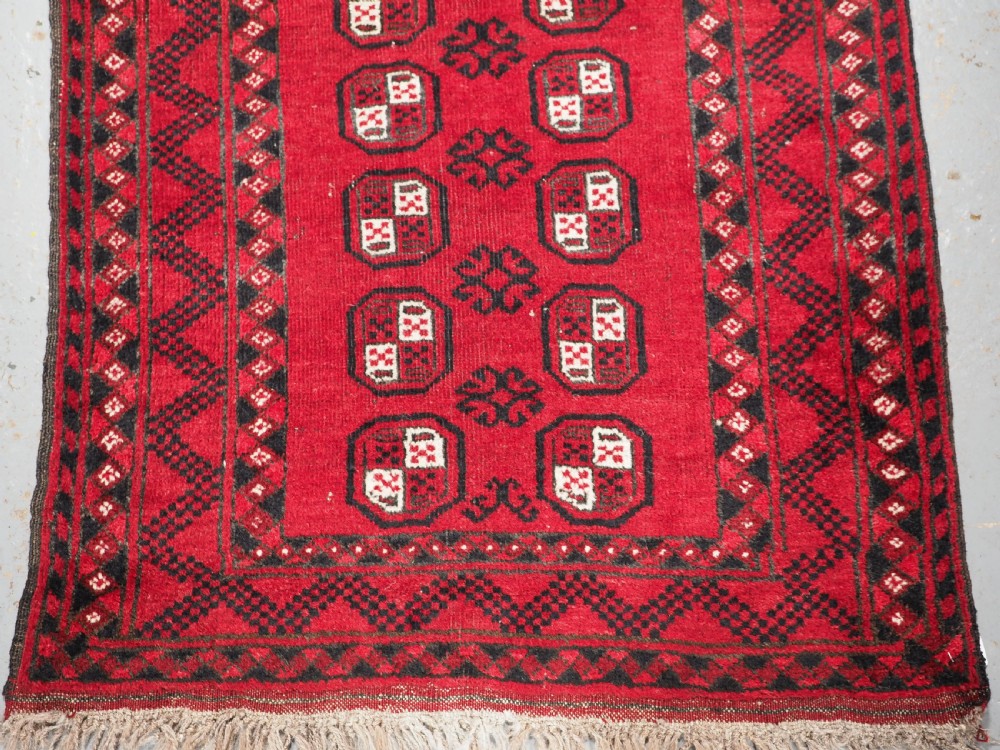 OLD AFGHAN VILLAGE RUG OF SMALL MAT SIZE, CIRCA 1930. View VI