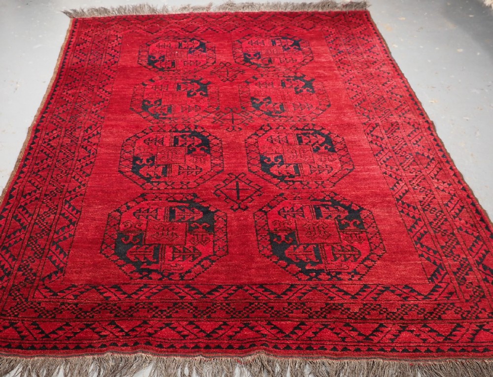 OLD AFGHAN VILLAGE RUG WITH ERSARI TURKMEN GUL DESIGN, CIRCA 1920.