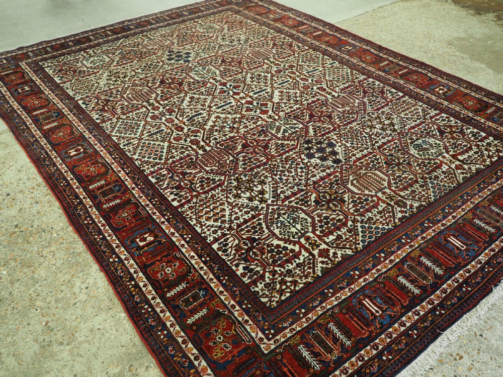 ANTIQUE JOSHAGHAN VILLAGE CARPET WITH TRADITIONAL SHRUB DESIGN CIRCA 1920.