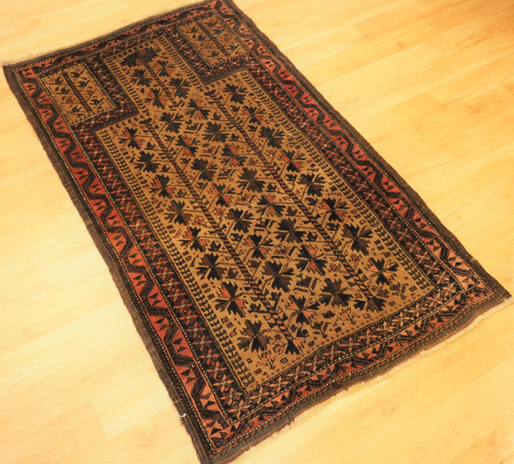 ANTIQUE BALUCH PRAYER RUG WITH TREE OF LIFE DESIGN ON A CAMEL GROUND, CIRCA 1900. View II