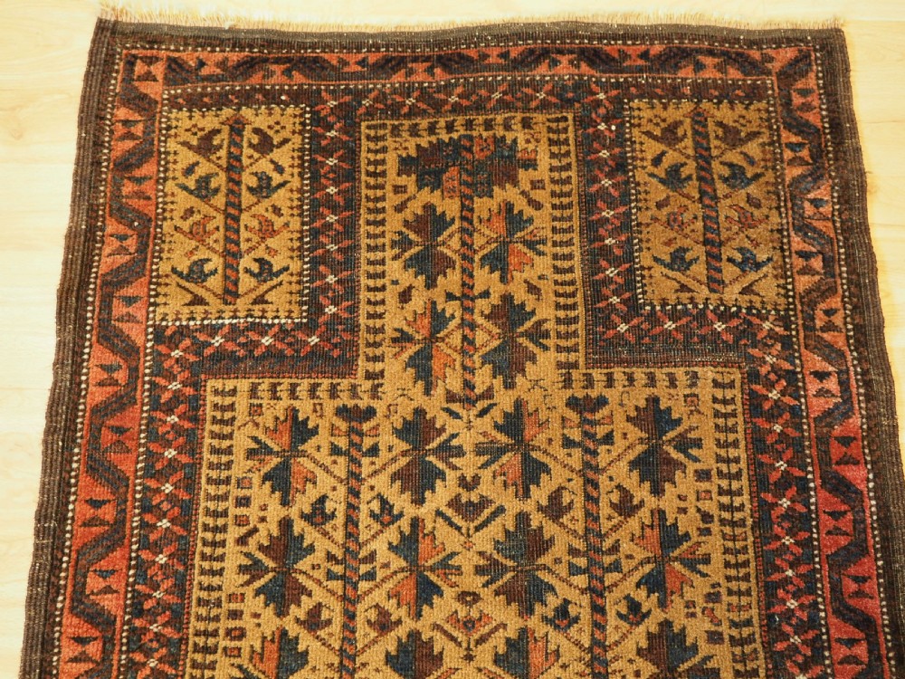 ANTIQUE BALUCH PRAYER RUG WITH TREE OF LIFE DESIGN ON A CAMEL GROUND, CIRCA 1900. View III