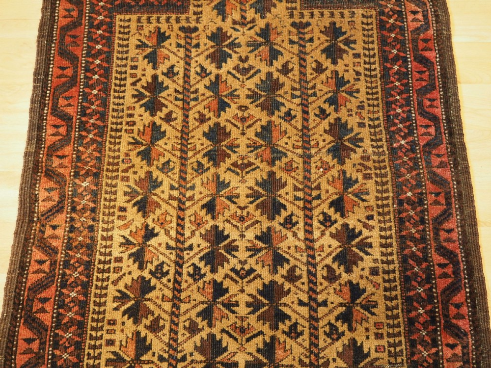 ANTIQUE BALUCH PRAYER RUG WITH TREE OF LIFE DESIGN ON A CAMEL GROUND, CIRCA 1900. View IV