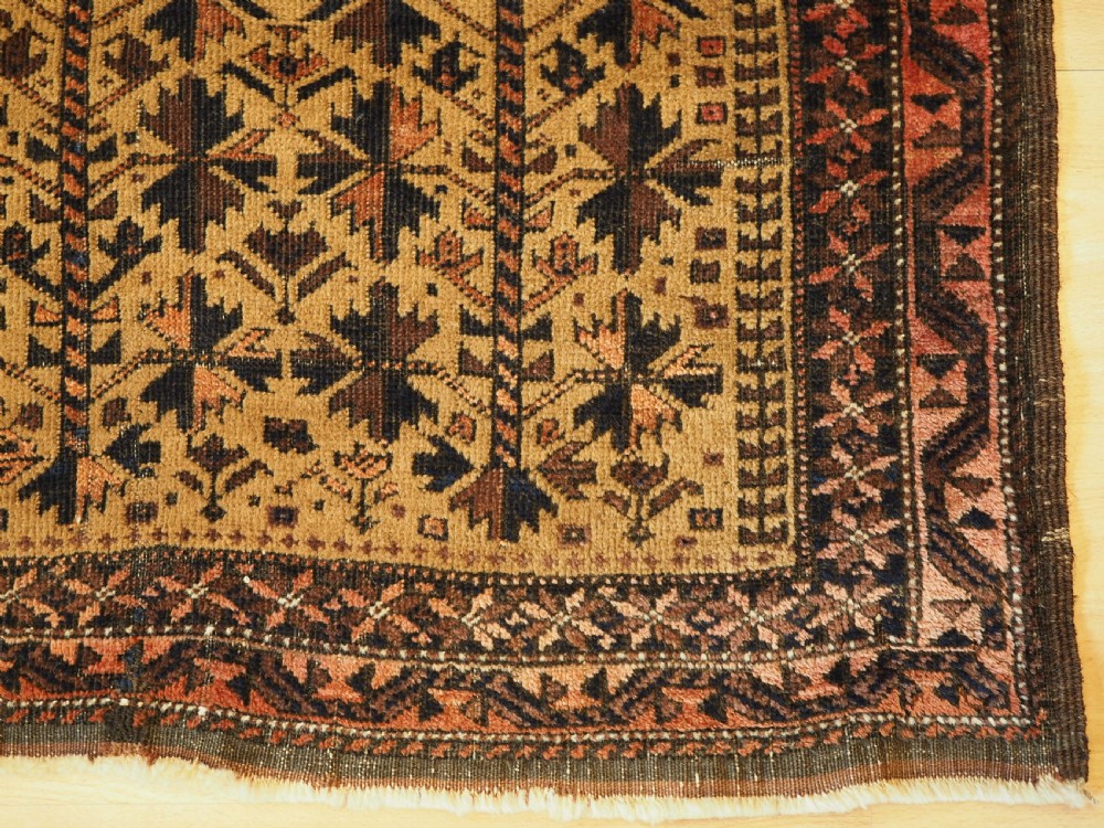 ANTIQUE BALUCH PRAYER RUG WITH TREE OF LIFE DESIGN ON A CAMEL GROUND, CIRCA 1900. View X
