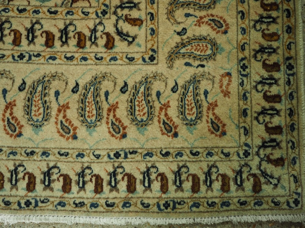 ANTIQUE KASHAN CARPET, IVORY GROUND WITH ALL OVER BOTEH DESIGN, CIRCA 1920. View X