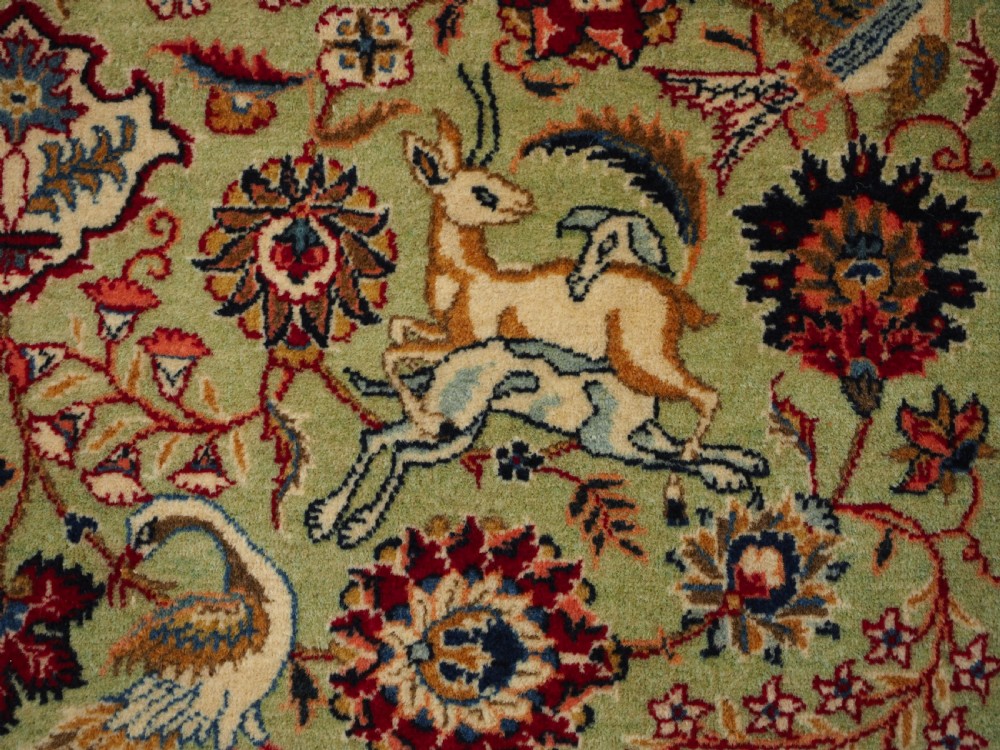 OLD TABRIZ RUG WITH HUNTING DESIGN ON A GREEN GROUND, CIRCA 1930. View X