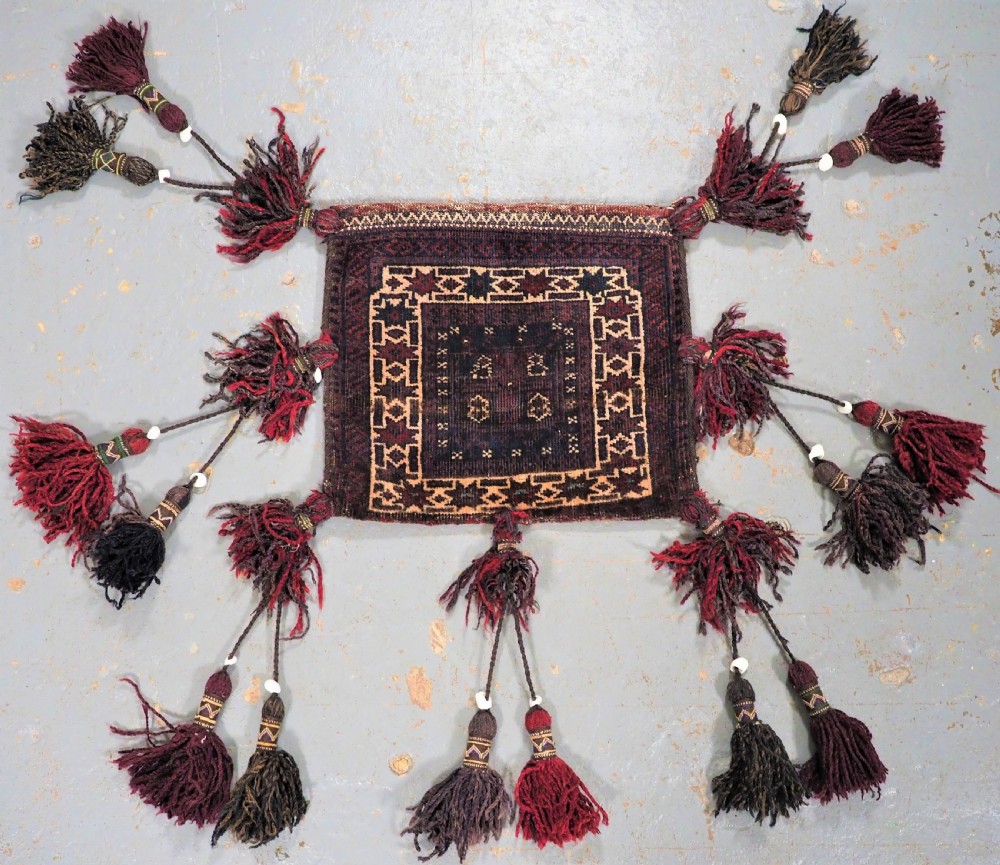 ANTIQUE BALUCH DOUBLE FACED VANITY BAG, SISTAN PROVINCE, AFGHANISTAN, CIRCA 1900.