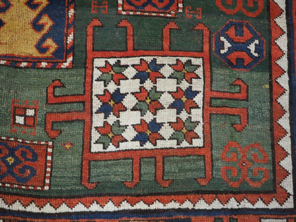 ANTIQUE CAUCASIAN KARACHOV KAZAK RUG WITH GREEN GROUND, CIRCA 1890. View IX