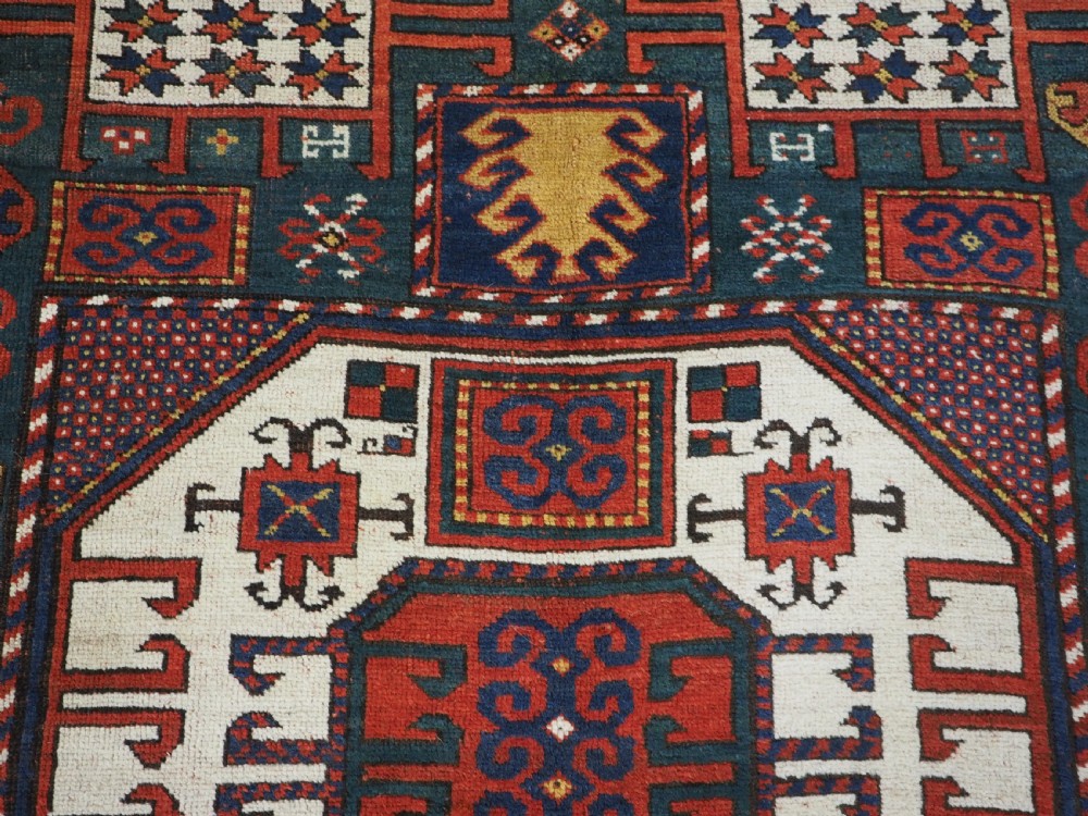 ANTIQUE CAUCASIAN KARACHOV KAZAK RUG WITH GREEN GROUND, CIRCA 1890. View XI