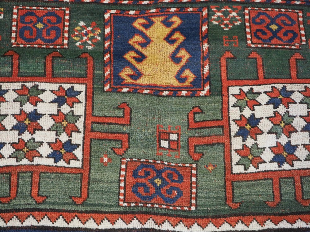 ANTIQUE CAUCASIAN KARACHOV KAZAK RUG WITH GREEN GROUND, CIRCA 1890. View XIII