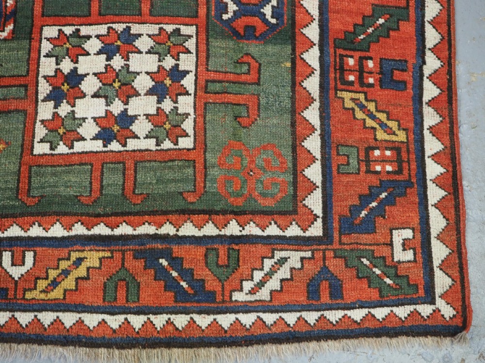 ANTIQUE CAUCASIAN KARACHOV KAZAK RUG WITH GREEN GROUND, CIRCA 1890. View XIV