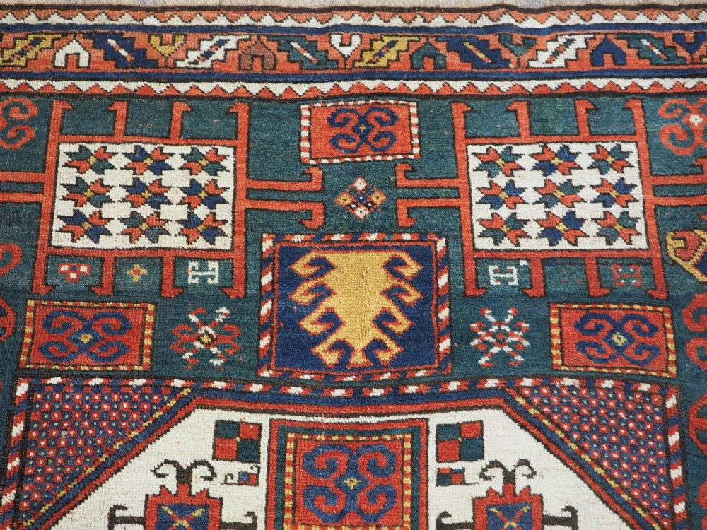 ANTIQUE CAUCASIAN KARACHOV KAZAK RUG WITH GREEN GROUND, CIRCA 1890. View XVI