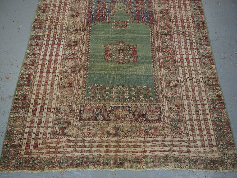 ANTIQUE TURKISH GHIORDES PRAYER RUG, MULTIPLE BORDERS, GREEN FIELD, CIRCA 1750. View V