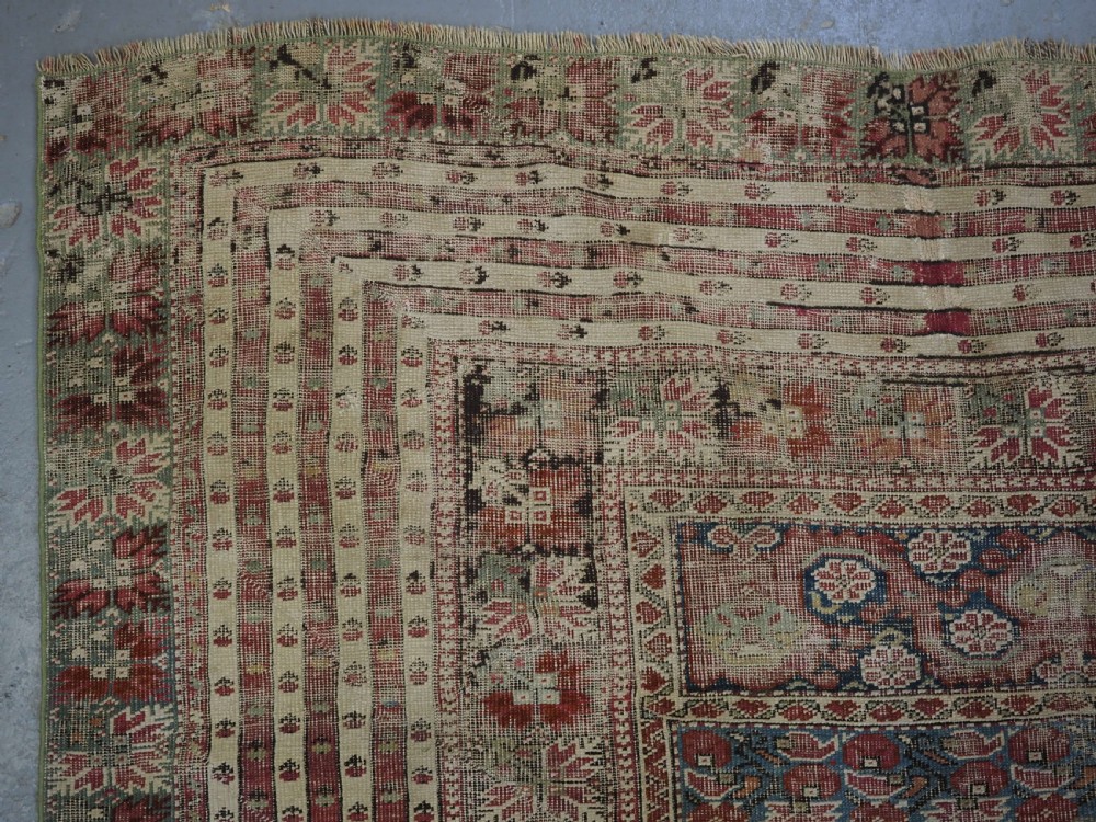 ANTIQUE TURKISH GHIORDES PRAYER RUG, MULTIPLE BORDERS, GREEN FIELD, CIRCA 1750. View VI