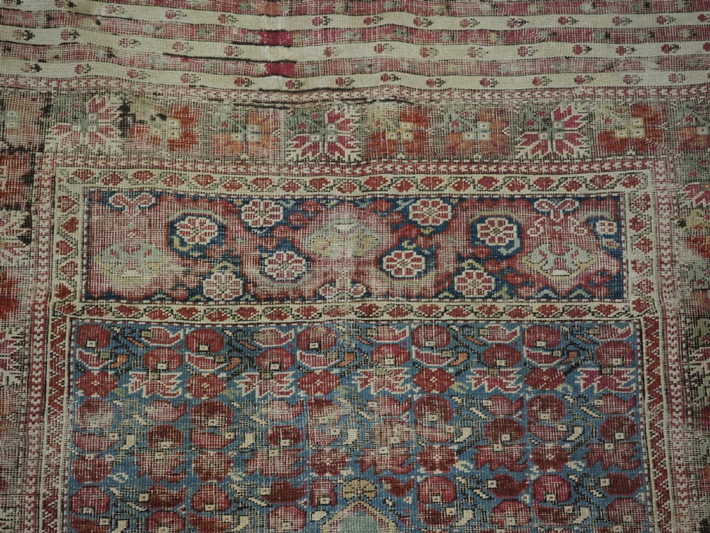 ANTIQUE TURKISH GHIORDES PRAYER RUG, MULTIPLE BORDERS, GREEN FIELD, CIRCA 1750. View VII