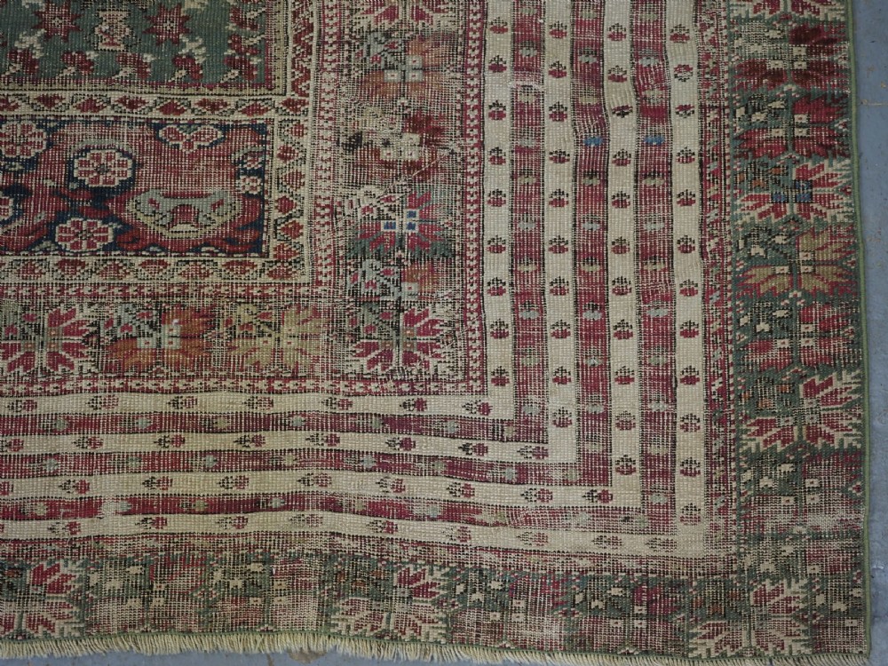 ANTIQUE TURKISH GHIORDES PRAYER RUG, MULTIPLE BORDERS, GREEN FIELD, CIRCA 1750. View XI