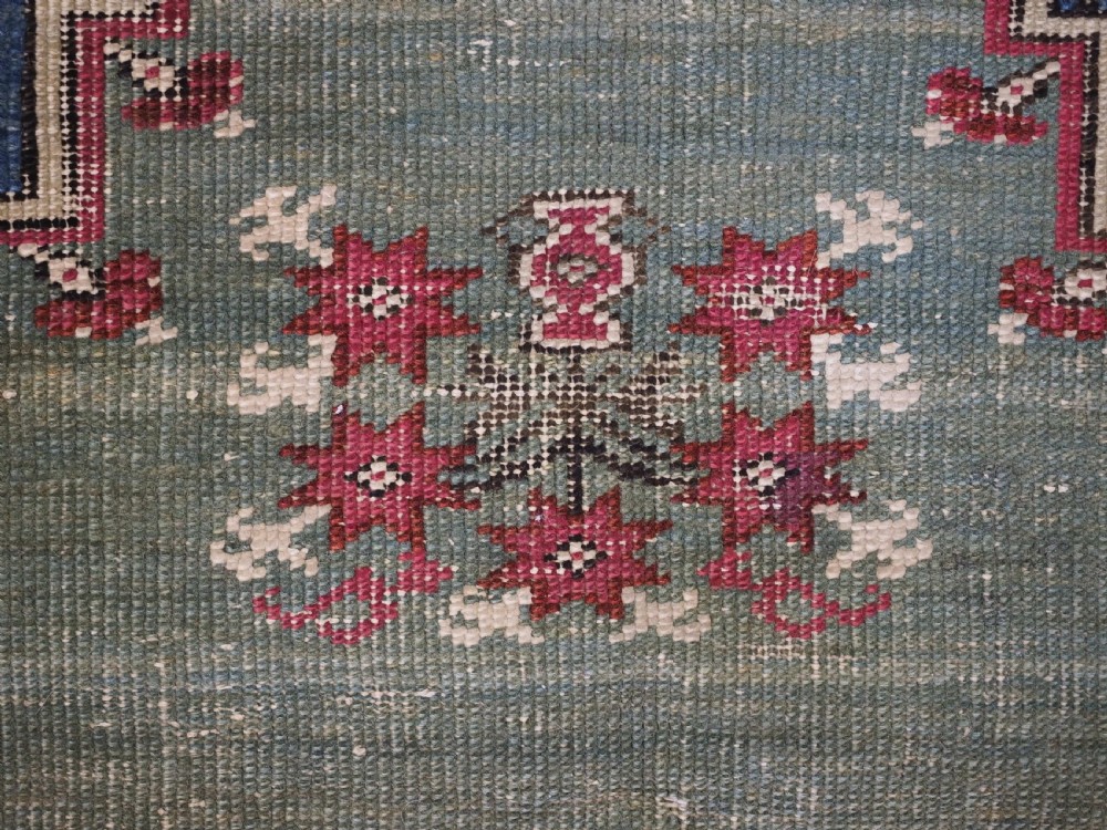 ANTIQUE TURKISH GHIORDES PRAYER RUG, MULTIPLE BORDERS, GREEN FIELD, CIRCA 1750. View XV