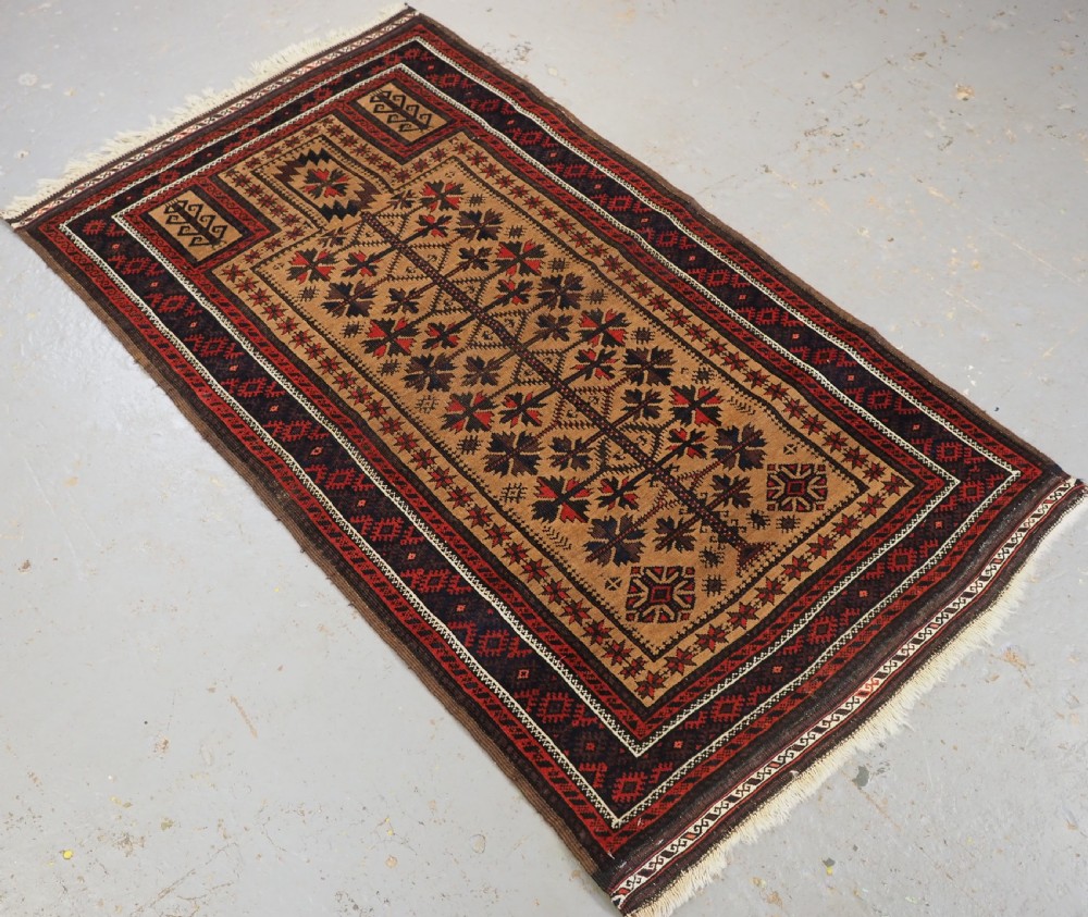 ANTIQUE BALUCH PRAYER RUG, 'SARAKHS' BALUCH, CAMEL GROUND, LATE 19TH CENTURY. View II