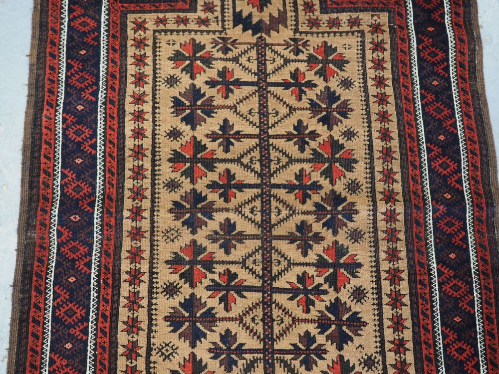 ANTIQUE BALUCH PRAYER RUG, 'SARAKHS' BALUCH, CAMEL GROUND, LATE 19TH CENTURY. View IV