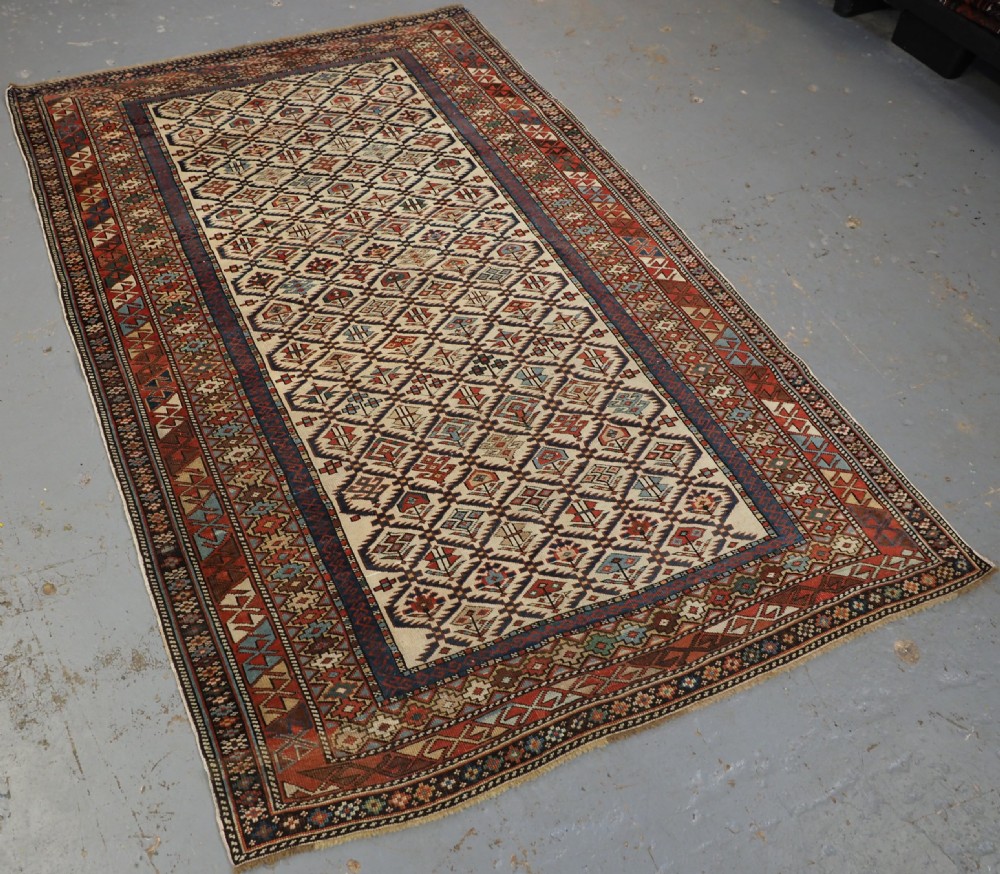 ANTIQUE CAUCASIAN DAGESTAN RUG WITH IVORY GROUND FLORAL LATTICE, SUPERB, CIRCA 1880. View II