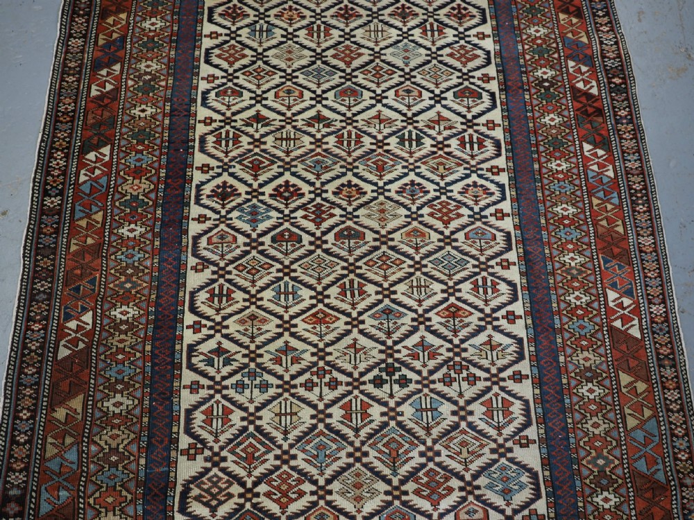 ANTIQUE CAUCASIAN DAGESTAN RUG WITH IVORY GROUND FLORAL LATTICE, SUPERB, CIRCA 1880. View III
