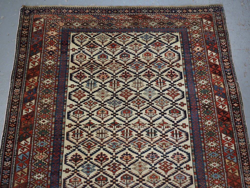 ANTIQUE CAUCASIAN DAGESTAN RUG WITH IVORY GROUND FLORAL LATTICE, SUPERB, CIRCA 1880. View IV