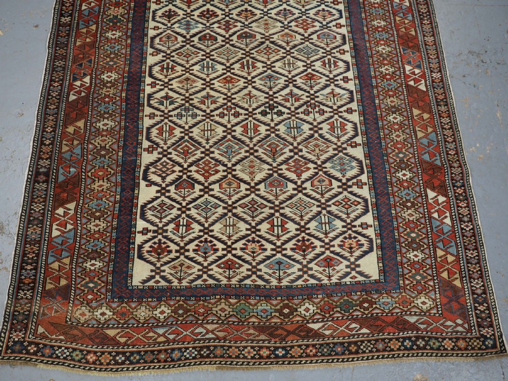 ANTIQUE CAUCASIAN DAGESTAN RUG WITH IVORY GROUND FLORAL LATTICE, SUPERB, CIRCA 1880. View V