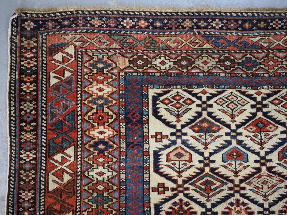 ANTIQUE CAUCASIAN DAGESTAN RUG WITH IVORY GROUND FLORAL LATTICE, SUPERB, CIRCA 1880. View VI