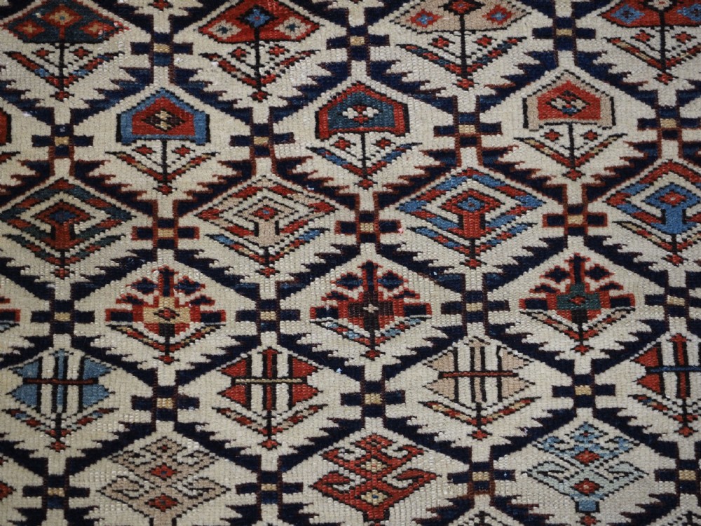 ANTIQUE CAUCASIAN DAGESTAN RUG WITH IVORY GROUND FLORAL LATTICE, SUPERB, CIRCA 1880. View VIII