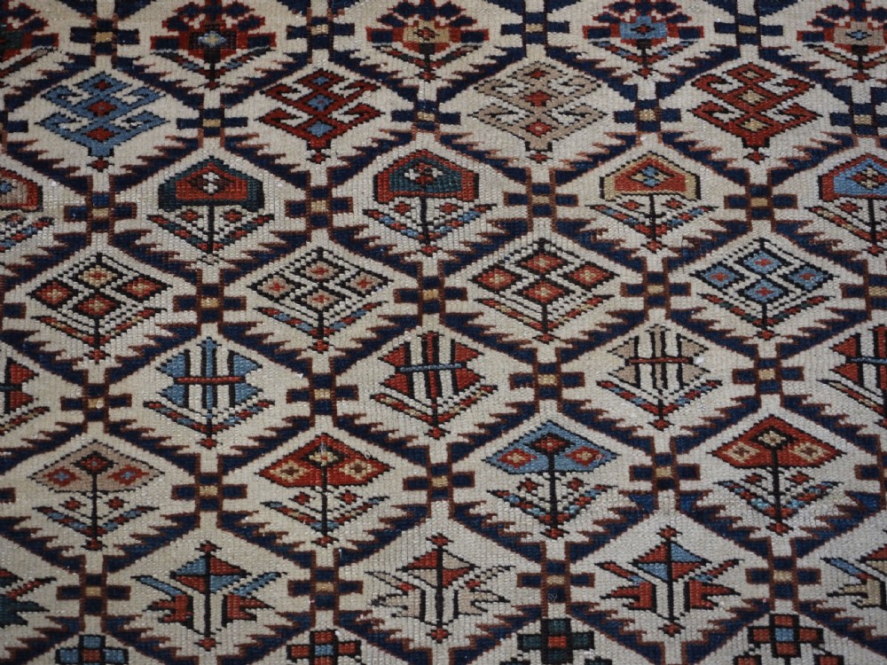 ANTIQUE CAUCASIAN DAGESTAN RUG WITH IVORY GROUND FLORAL LATTICE, SUPERB, CIRCA 1880. View IX