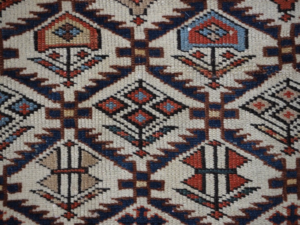 ANTIQUE CAUCASIAN DAGESTAN RUG WITH IVORY GROUND FLORAL LATTICE, SUPERB, CIRCA 1880. View X