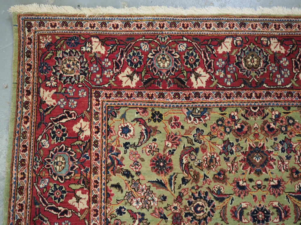 ANTIQUE KASHAN RUG WITH FINE FLORAL DESIGN ON A SCARCE GREEN GROUND, CIRCA 1900. View VI
